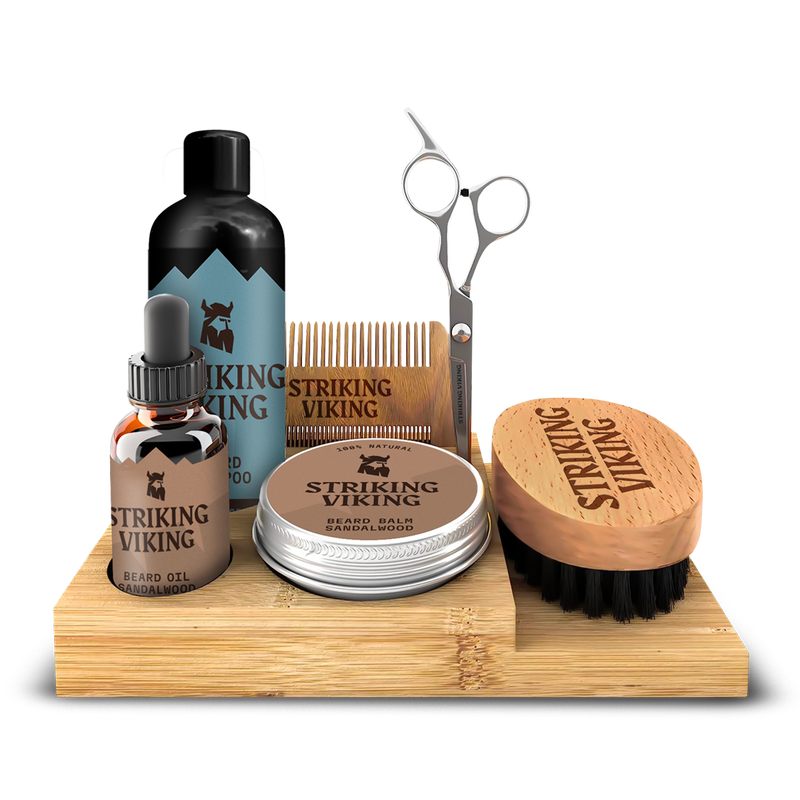 Beard grooming kit with caddy, including beard oil, shampoo, balm, scissors, brush, and comb.