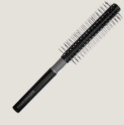 Black round hair brush with ball-tipped bristles and rubberized grip for smooth, tangle-free styling and blow-drying medium to long hair