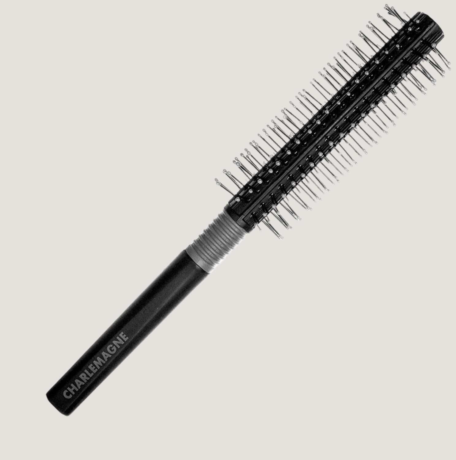 Black round hair brush with ball-tipped bristles and rubberized grip for smooth, tangle-free styling and blow-drying medium to long hair