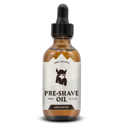 Unscented pre-shave oil for men in a glass bottle with dropper, offering enhanced glide and skin protection for smooth shaving.