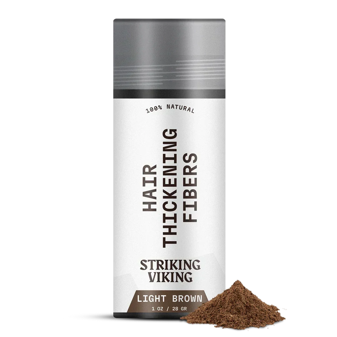 Striking Viking Hair Thickening Fibers for men in light brown, 1 oz bottle with natural fibers.