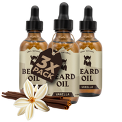 Three-pack of vanilla scented natural beard oil bottles with dropper caps and vanilla flower with cinnamon sticks.