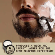 Vanilla scented shaving cream being applied to a man's face with a brush; product labeled Striking Viking.