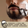 Vanilla scented shaving cream being applied to a man's face with a brush; product labeled Striking Viking.