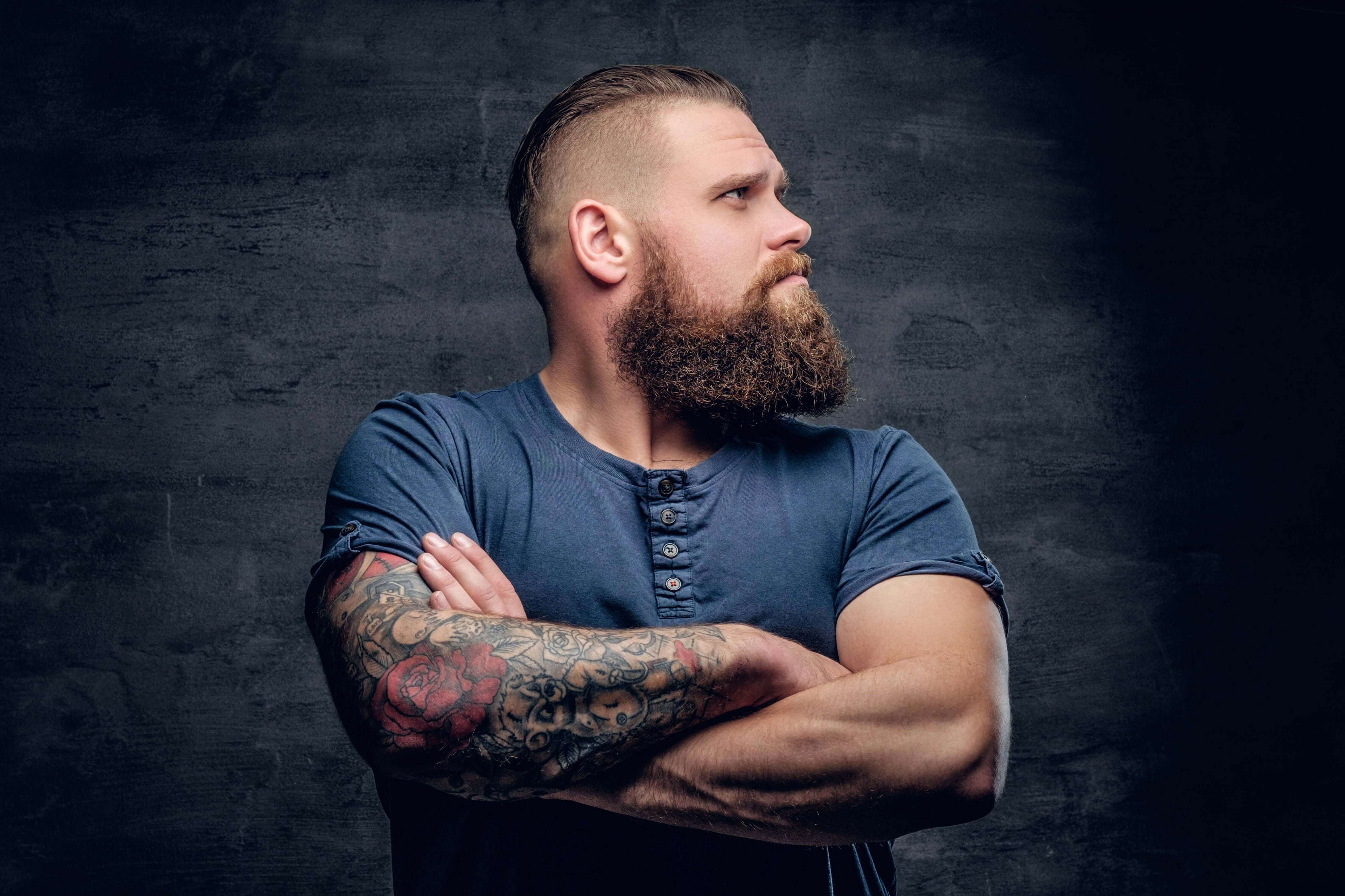 portrait-brutal-bearded-male-with-tattooed-crossed-arms_77b1e421-6394-43d0-a5c5-38fbf712335e.jpg